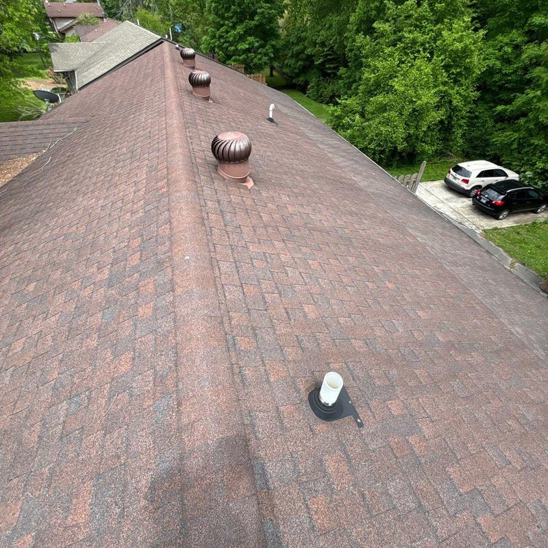 Asphalt shingle roof with ventilation turbines and pipes