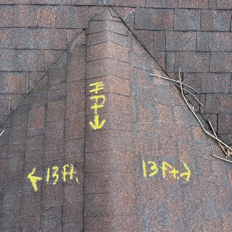 Asphalt shingle roof with hail damage markings