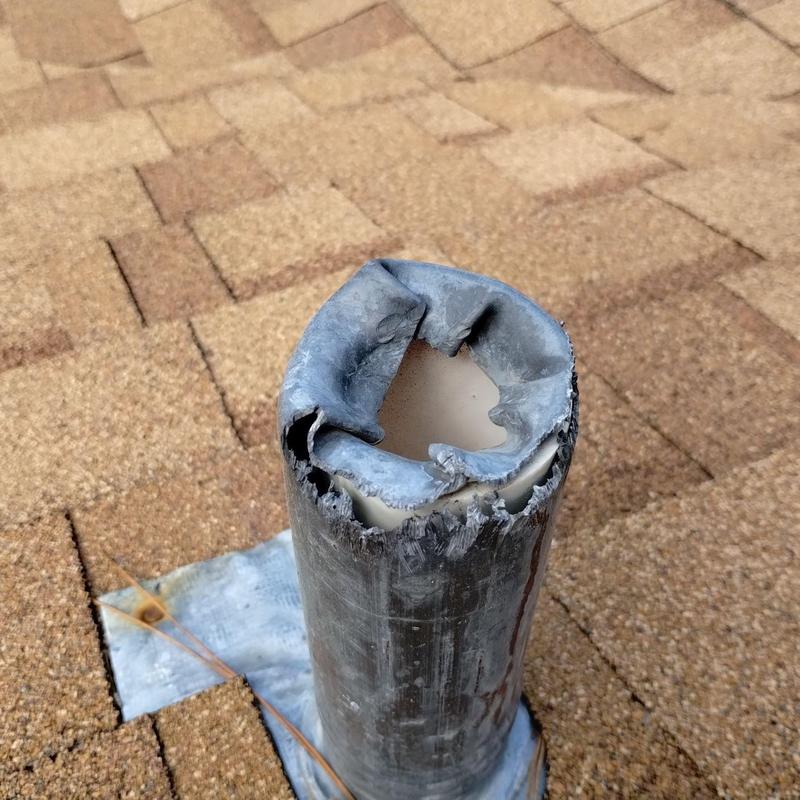 Pipe flashing with severe squirrel damage on roof Pipe flashing with severe squirrel damage on roof
