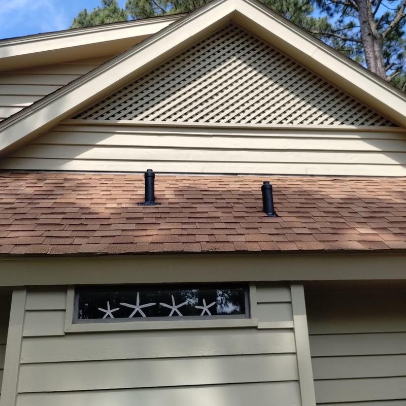 Pipe flashing with custom squirrel-resistant protectors on roof Pipe flashing with custom squirrel-resistant protectors on roof