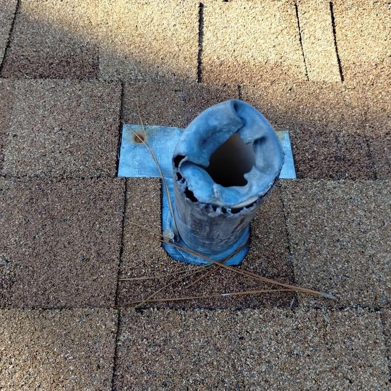 Pipe flashing with squirrel damage on shingle roof Pipe flashing with squirrel damage on shingle roof