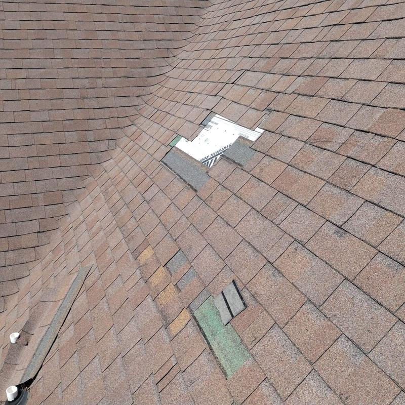Storm damaged asphalt shingles with roof repairs needed Storm damaged asphalt shingles with roof repairs needed