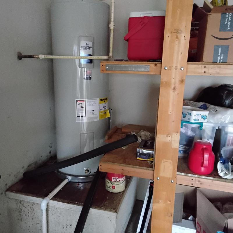 Bradford White water heater installation in utility area