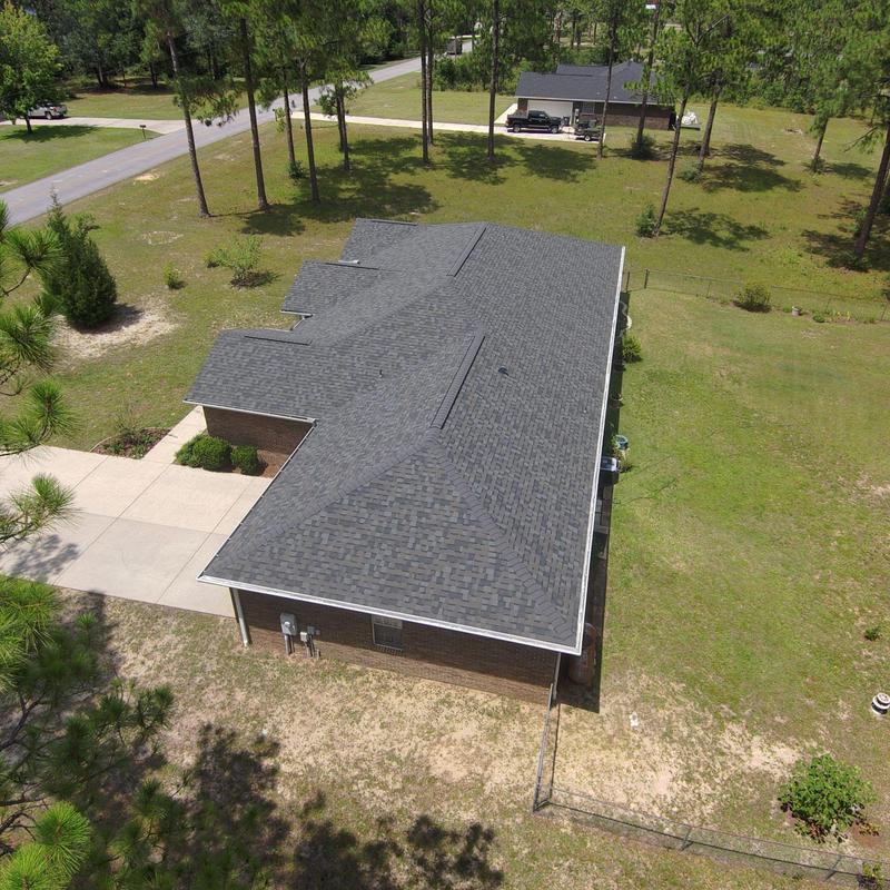 Asphalt shingle roof full replacement after wind damage