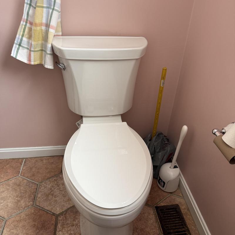Toilet installation with new fixture in bathroom