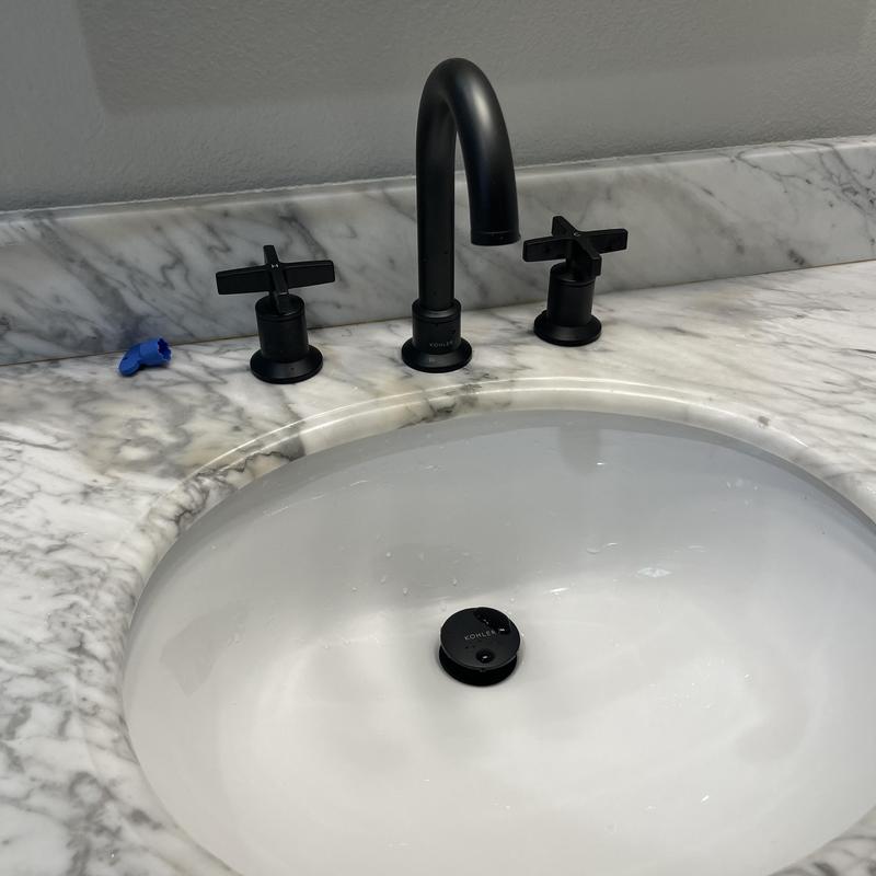 Widespread bathroom faucet and pop-up drain installation