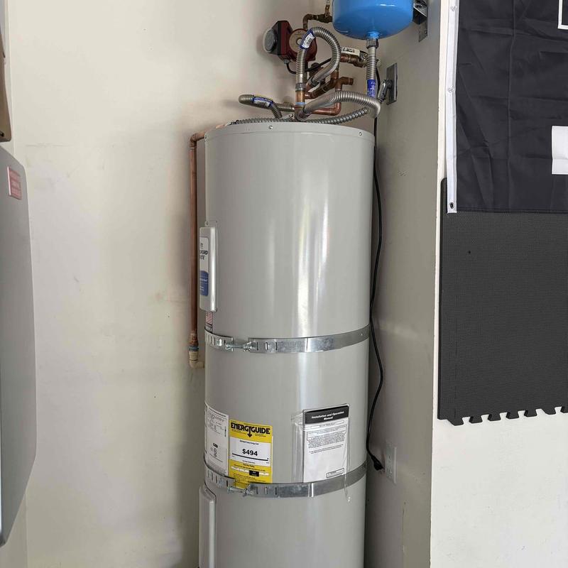 Electric water heater with code upgrades and piping