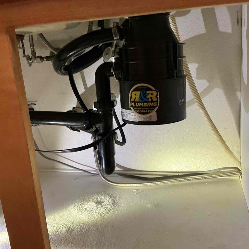 Garbage disposal with quick-release mount installed