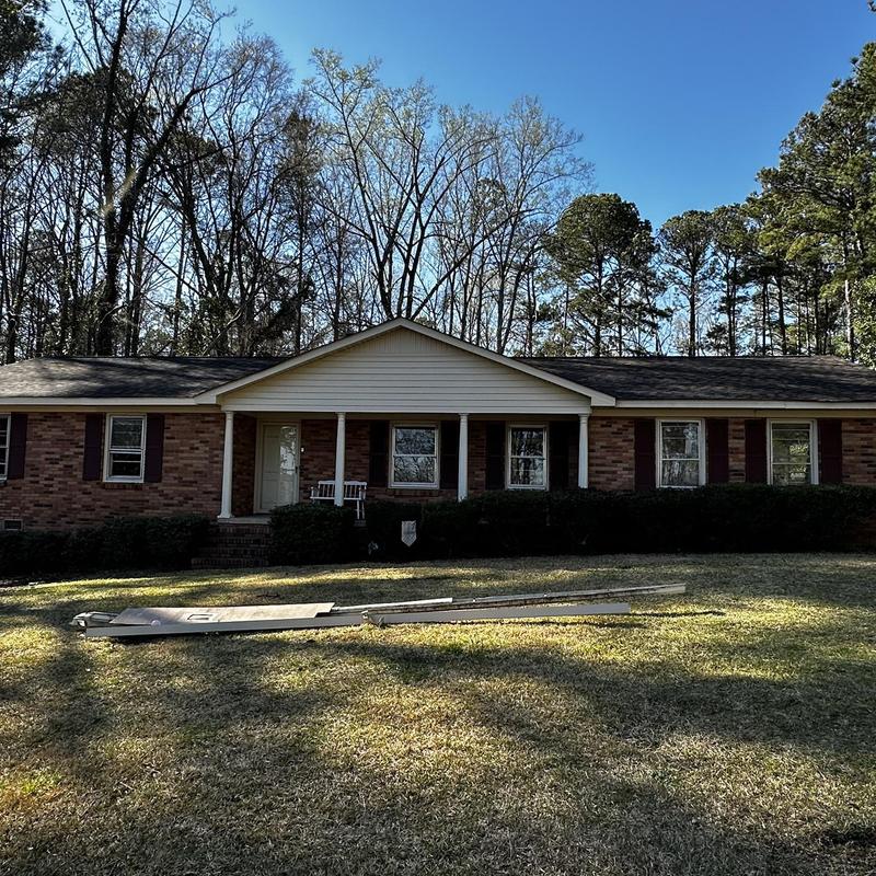 IKO Dynasty shingles on brick ranch home exterior IKO Dynasty shingles on brick ranch home exterior