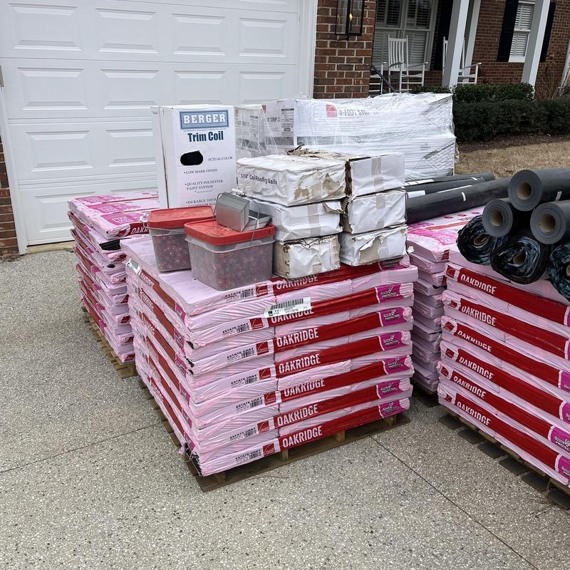 Owens Corning Oakridge shingles stacked on pallets Owens Corning Oakridge shingles stacked on pallets
