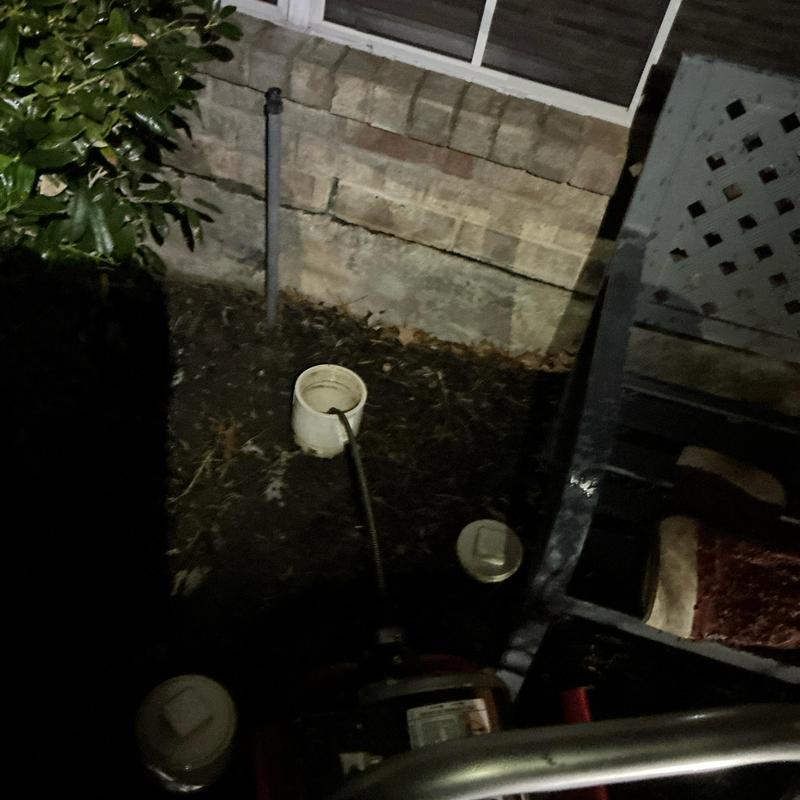 Sewer cleanout with cable clearing stoppage at night