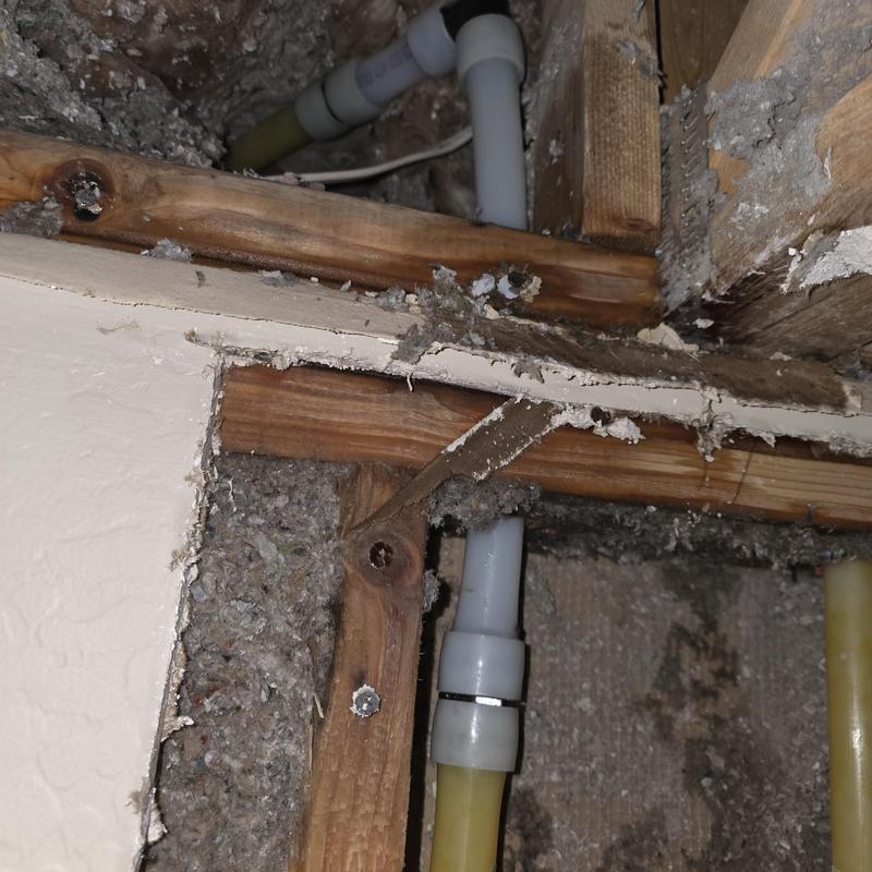 1-inch PEX piping leak behind cut drywall ceiling panel