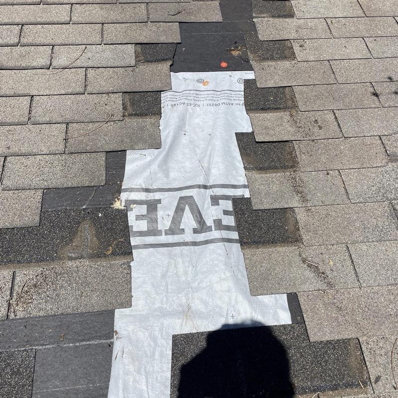 Asphalt shingles with exposed underlayment repair area