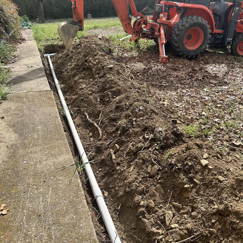 Septic tank drainage pipe installation with excavator Septic tank drainage pipe installation with excavator