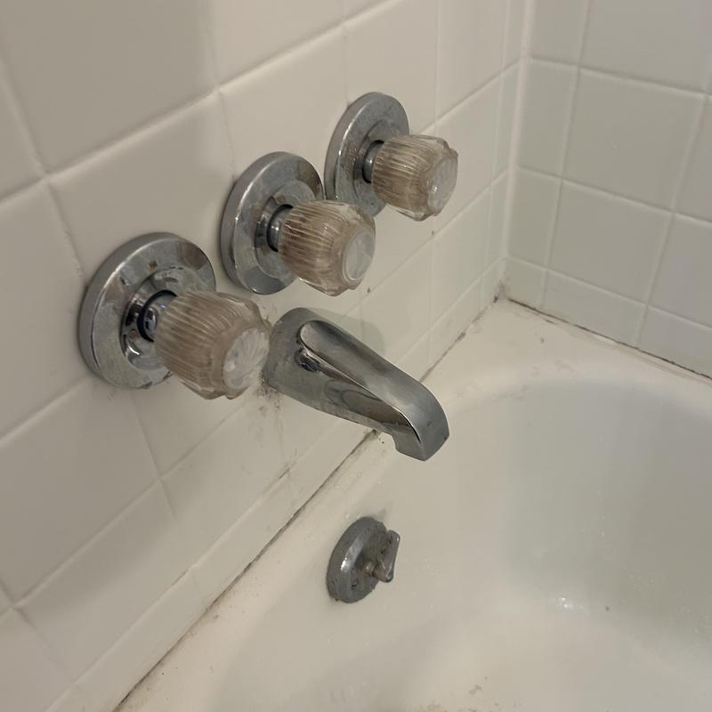 Tub shower faucet with three handle controls and spout