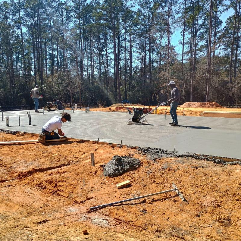 Concrete foundation slab finishing on construction site
