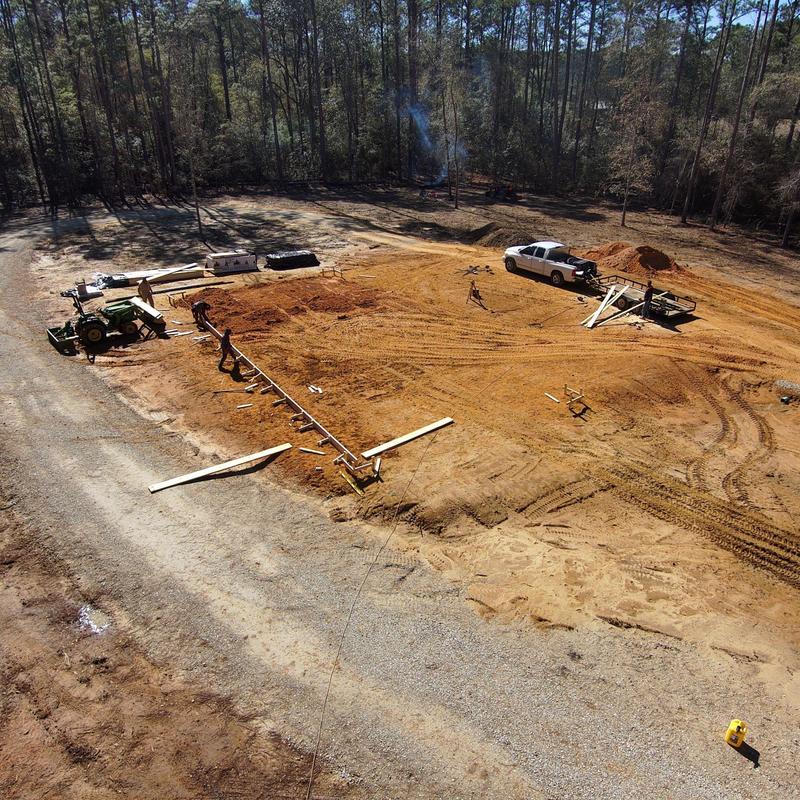 Custom home foundation site with framing and equipment