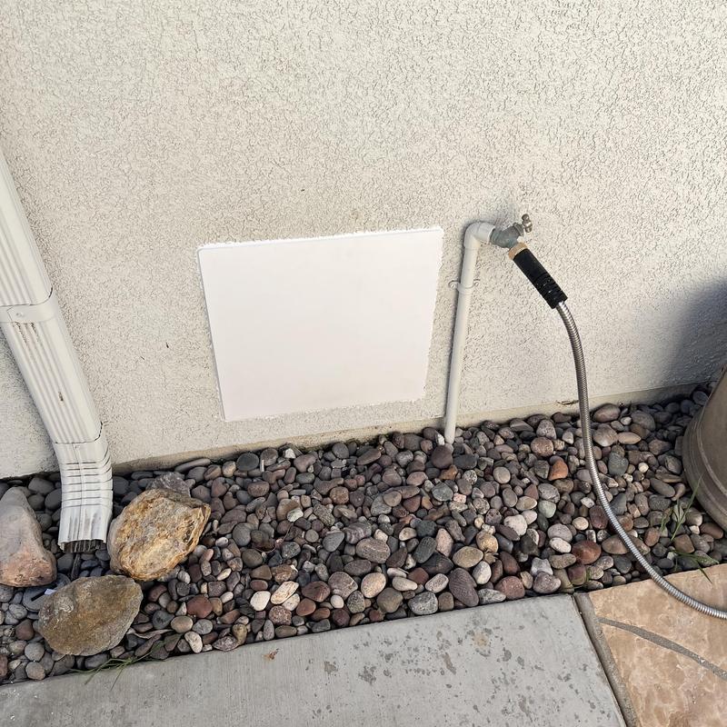 Roman tub valve access panel cut in exterior wall