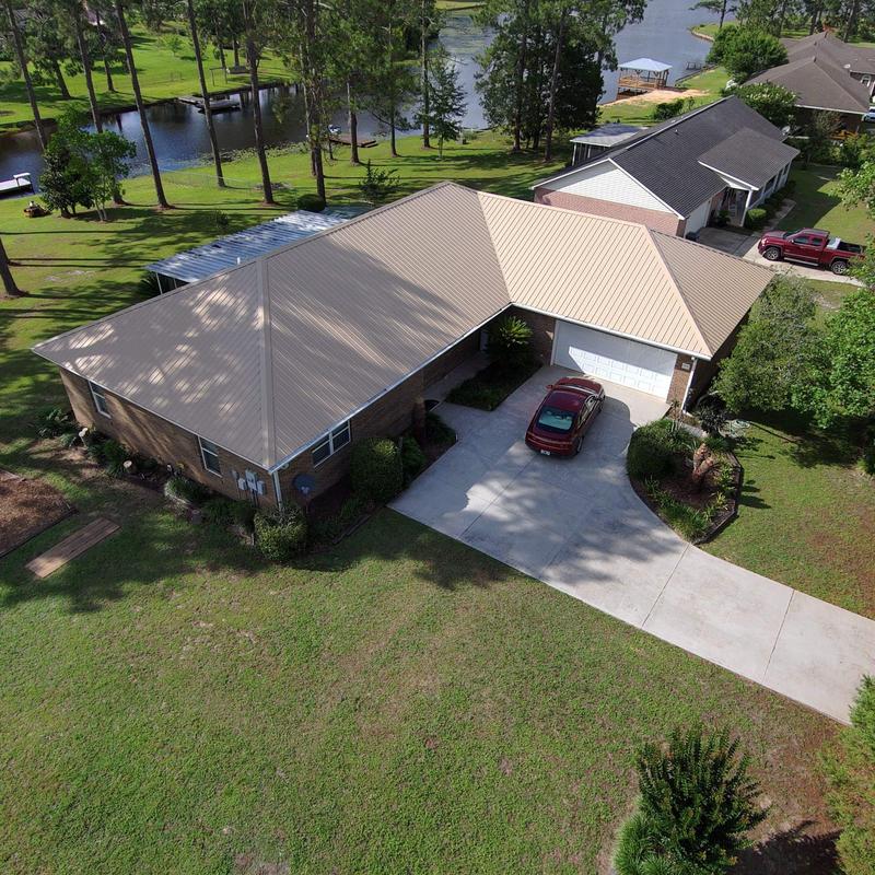Metal roof installation on single-story home