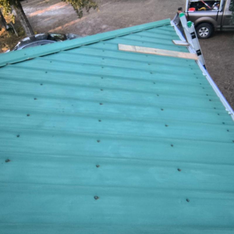 Metal roof with upgraded ZAC screws on ladder