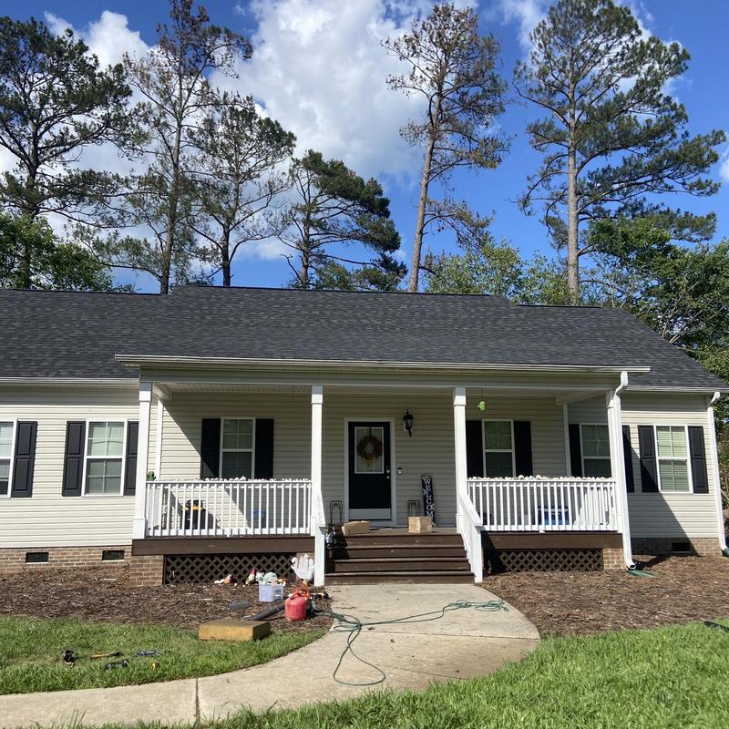 IKO Dynasty Granite Black shingle roof with new gutters IKO Dynasty Granite Black shingle roof with new gutters