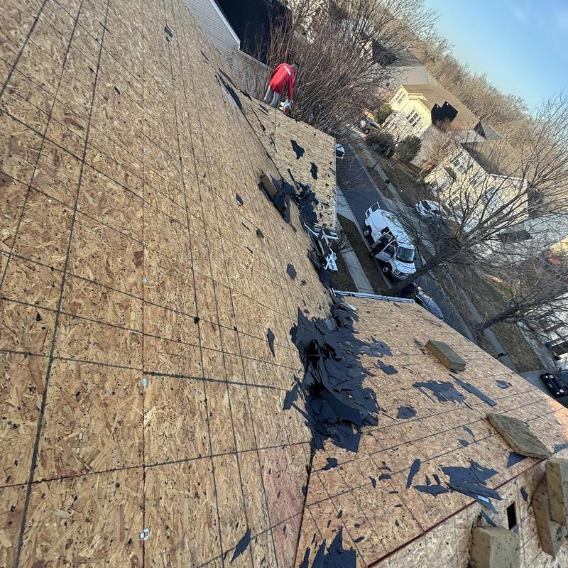 Roof decking with debris removal in progress