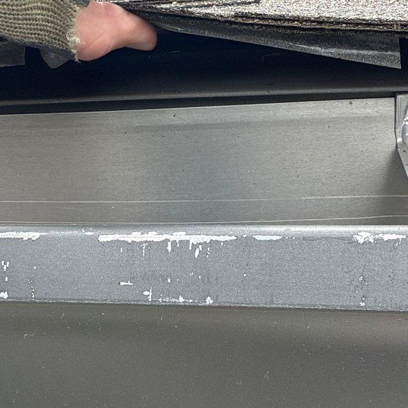 Asphalt shingle roof and metal flashing inspection detail