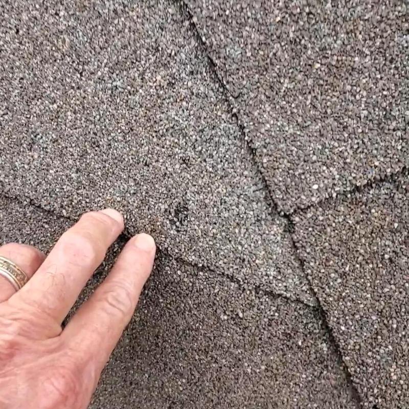 Asphalt shingles with hail damage on roof in Terrell, TX
