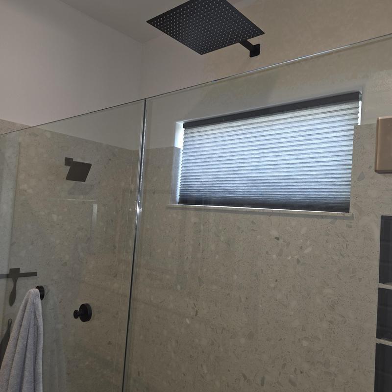 Rain shower head installation in tiled shower area