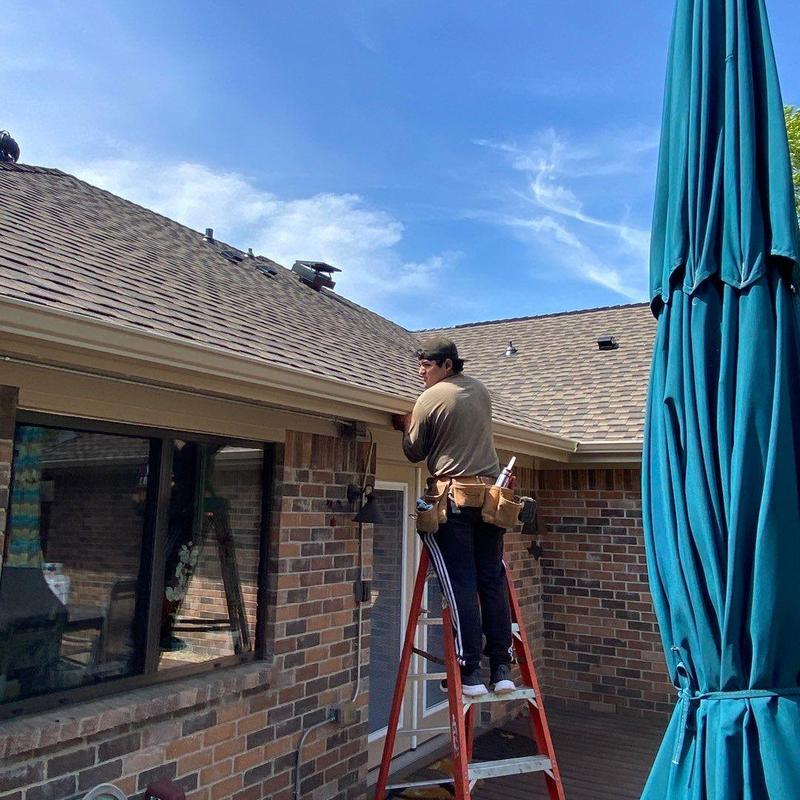 Seamless gutter installation on brick home exterior Seamless gutter installation on brick home exterior