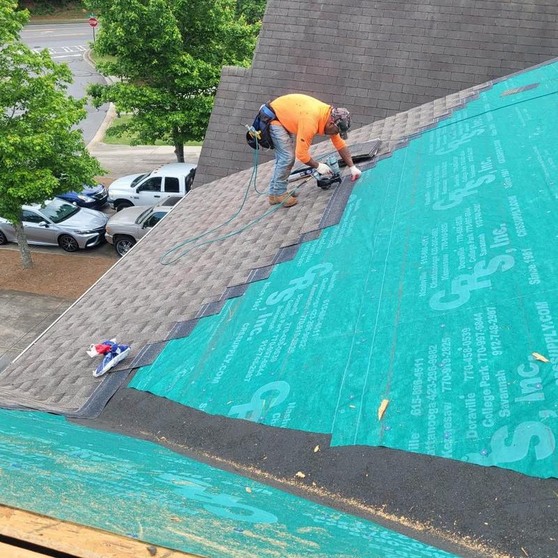 Roof shingles installation on pitched residential roof