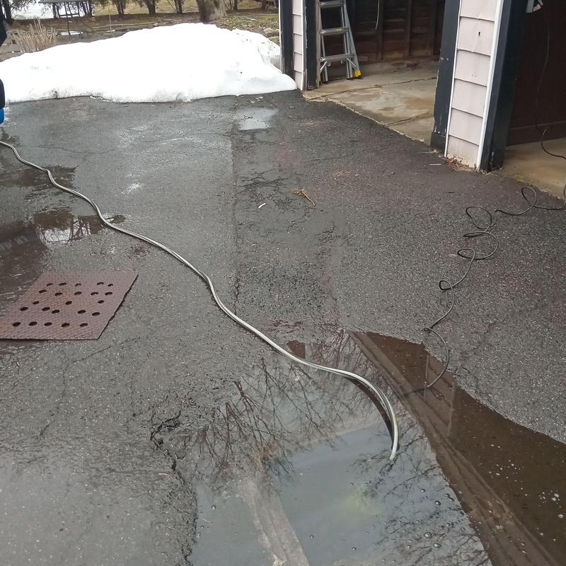 Driveway drain pumping with diagnostic cable inserted Driveway drain pumping with diagnostic cable inserted