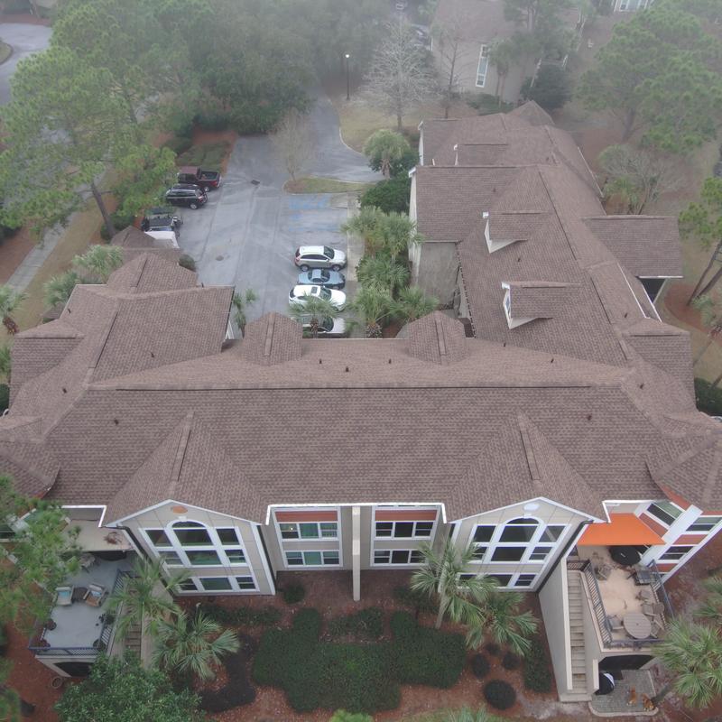 Roof with custom angled pipe protectors and cleared pine straw