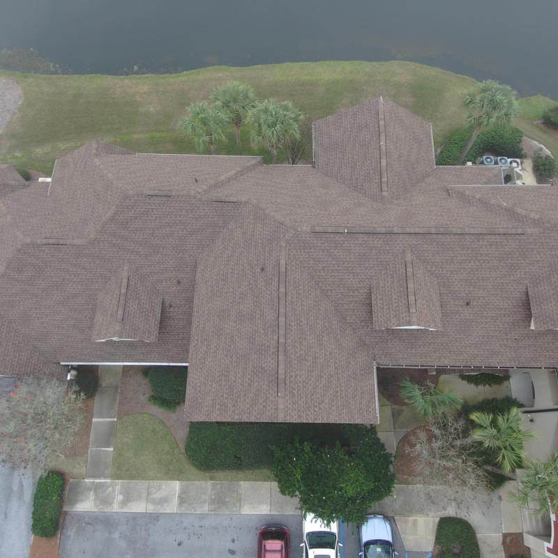 Roof with custom angled pipe protectors and pine straw removal