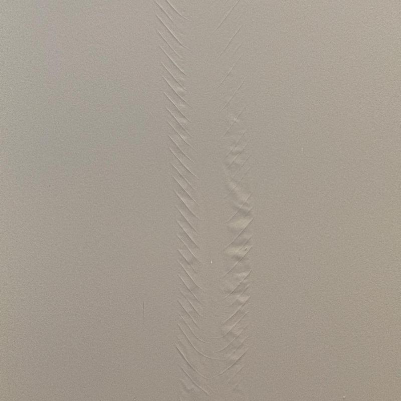 Drywall with vertical water damage and bubbling paint