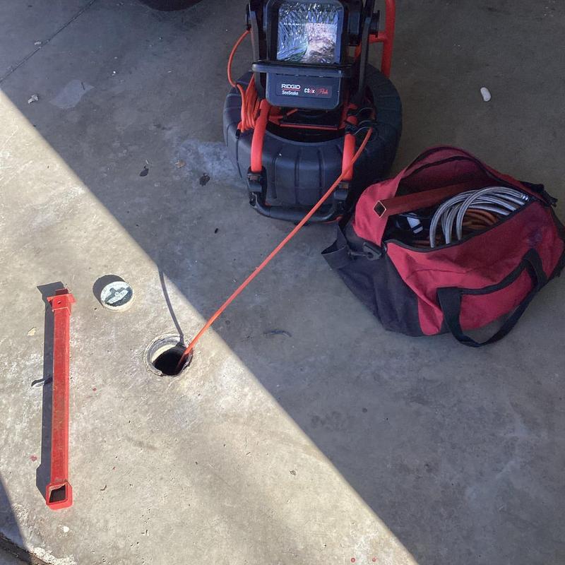 Main sewer line camera inspection through garage cleanout