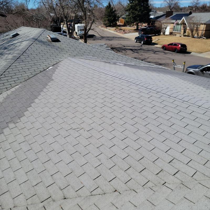 Three-tab shingle roof with weathering and cracks Three-tab shingle roof with weathering and cracks