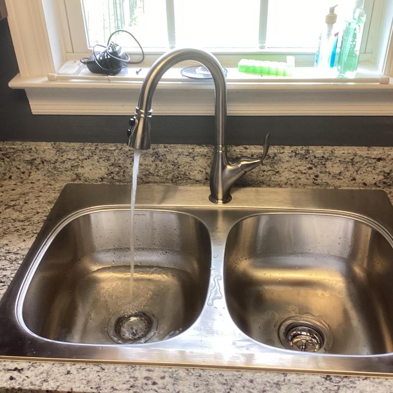 Kitchen sink and faucet installation with water flow