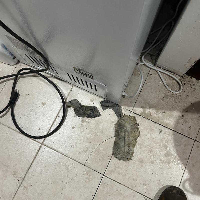 Drain jetting debris on tiled floor near HVAC unit Drain jetting debris on tiled floor near HVAC unit