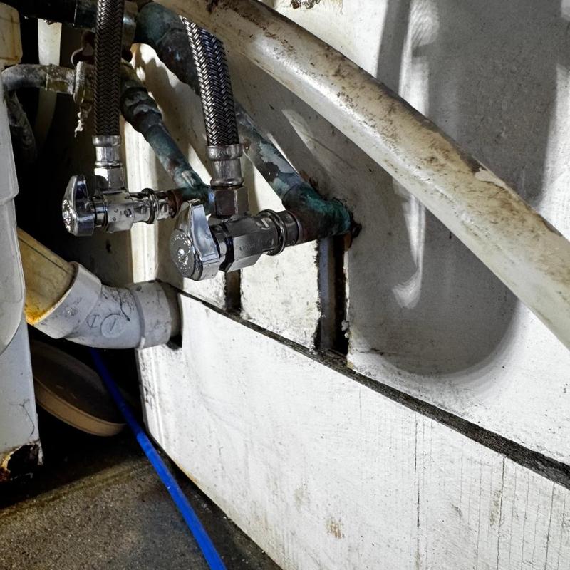 Laundry faucet with two chrome angle stops installed