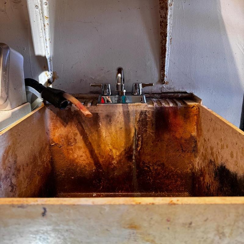 Laundry faucet with new angle stops above utility sink