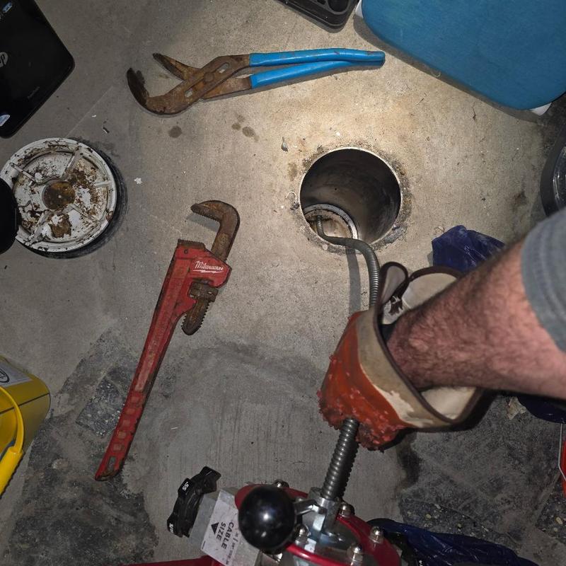 Sewer line blockage clearing with cable auger