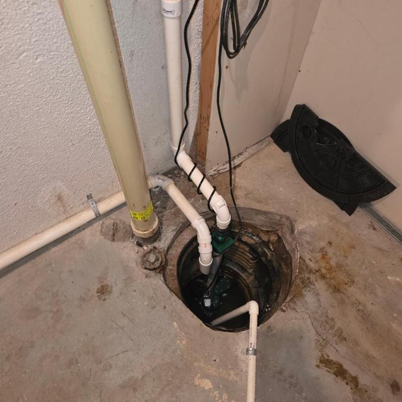 13 HP Zoeller sump pump with PVC discharge pipe