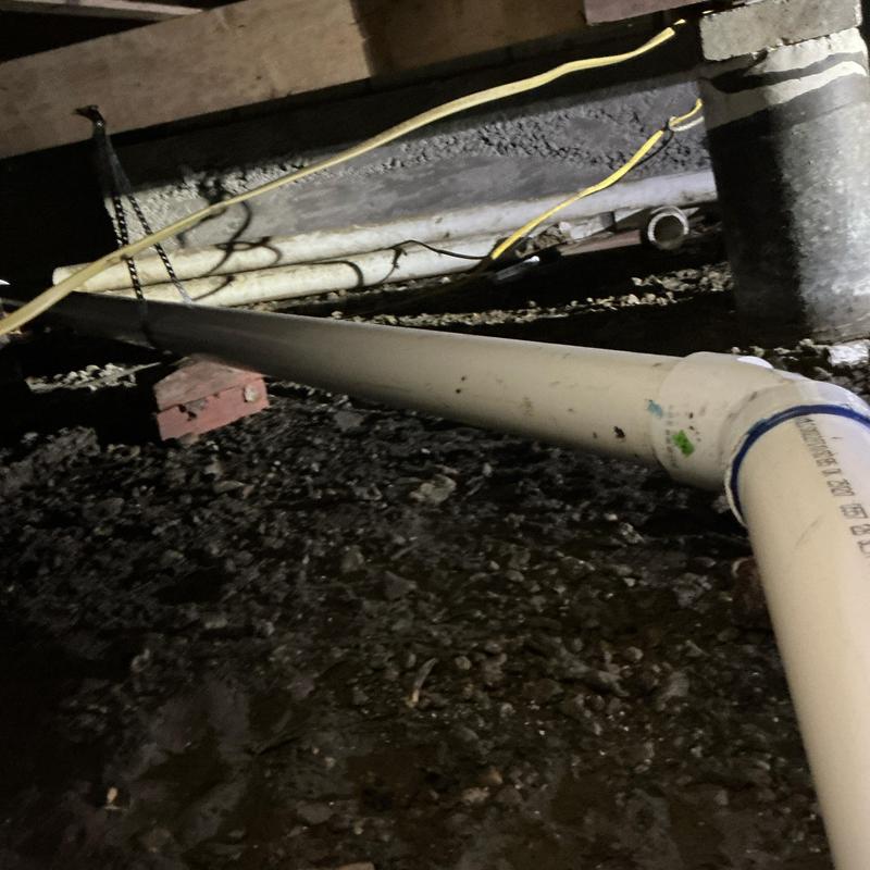 PVC drain pipe with hangers and proper fall installation PVC drain pipe with hangers and proper fall installation