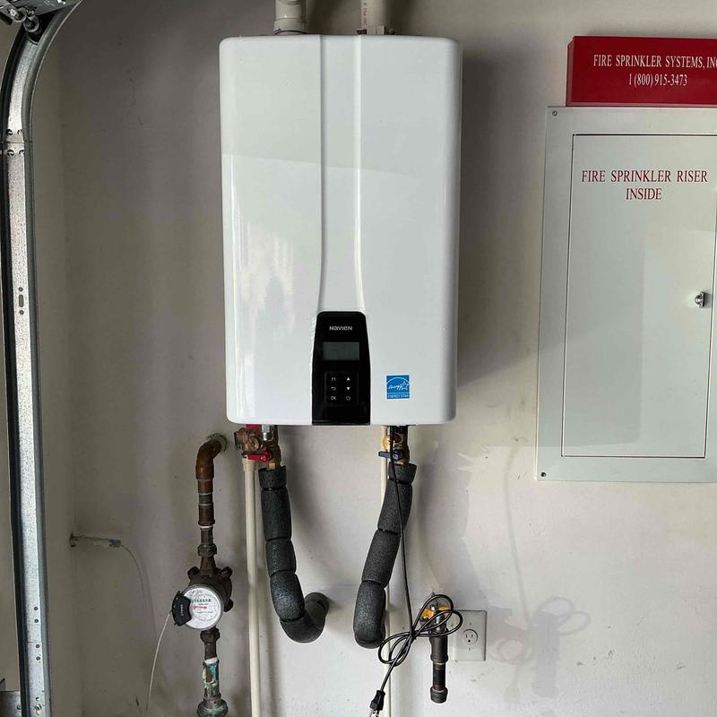 Navien tankless water heater with piping and meter