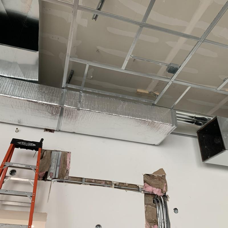 Commercial insulated ductwork installation in restaurant ceiling