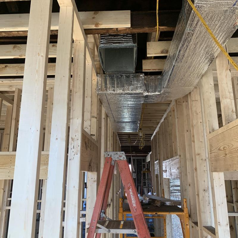 Insulated HVAC ductwork installation in wood framing