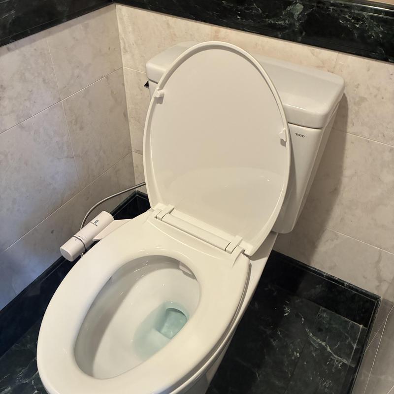 Toto elongated toilet installation with bidet attachment