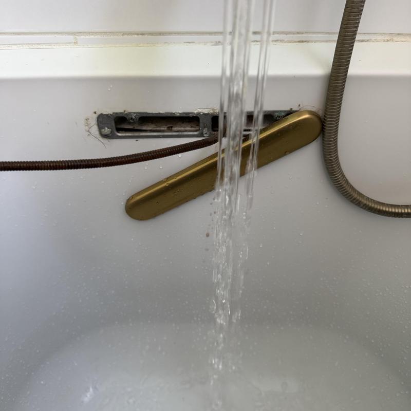 Bathtub drain snaking with water flow restoration