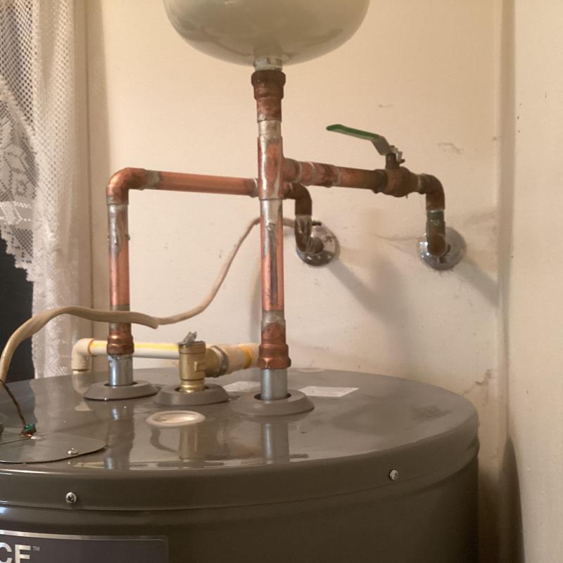 Electric water heater with copper piping connections